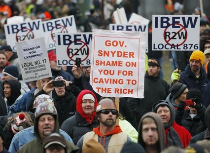 Anti right-to-work protesters gather outside of Michigan's state capitol building in Lansing December 11, 2012. REUTERS/Rebecca Cook Anti right-to-work protesters gather outside of Michigan's state capitol building in Lansing December 11, 2012. REUTERS/Rebecca Cook