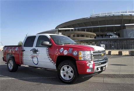 A 2013 Chevrolet Silverado pickup truck, painted with logos of both American League and National League teams, is pictured in front of Kauff A 2013 Chevrolet Silverado pickup truck, painted with logos of both American League and National League teams, is pictured in front of Kauff