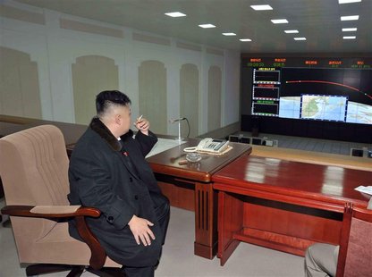 North Korean leader Kim Jong-Un smokes a cigarette at the General Satellite Control and Command Center after the launch of the Unha-3 (Milky North Korean leader Kim Jong-Un smokes a cigarette at the General Satellite Control and Command Center after the launch of the Unha-3 (Milky