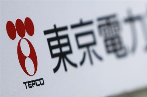 A Tokyo Electric Power Co (TEPCO) logo is pictured on a sign showing the way to the venue of the company's annual shareholders' meeting in T A Tokyo Electric Power Co (TEPCO) logo is pictured on a sign showing the way to the venue of the company's annual shareholders' meeting in T