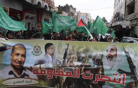 Palestinians wave Hamas flags during a rally celebrating what they claim to be Hamas' victory over Israel in the Gaza conflict, in the West Palestinians wave Hamas flags during a rally celebrating what they claim to be Hamas' victory over Israel in the Gaza conflict, in the West