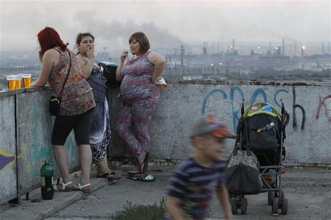 Local residents meet during sunset, with the Metallurgical Plant seen in the background, in the Southern Urals city of Magnitogorsk, July 13 Local residents meet during sunset, with the Metallurgical Plant seen in the background, in the Southern Urals city of Magnitogorsk, July 13