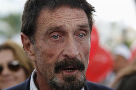 Computer software pioneer John McAfee speaks with reporters outside his hotel in Miami Beach, Florida December 13, 2012. REUTERS/Joe Skipper Computer software pioneer John McAfee speaks with reporters outside his hotel in Miami Beach, Florida December 13, 2012. REUTERS/Joe Skipper