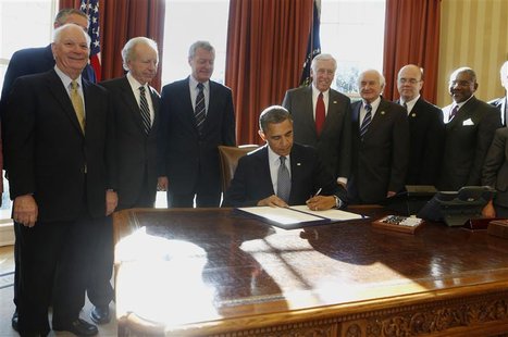 U.S. President Barack Obama (seated) signs into law H.R. 6156, the Russia and Moldova Jackson-Vanik Repeal and Magnitsky Rule of Law Account U.S. President Barack Obama (seated) signs into law H.R. 6156, the Russia and Moldova Jackson-Vanik Repeal and Magnitsky Rule of Law Account
