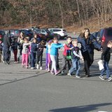 State police personnel lead children from the Sandy Hook Elementary School in this handout picture from the Newtown Bee, in Newtown, Connecticut, December 14, 2012. All public schools in Newtown, Connecticut, were placed in lockdown on Friday following a shooting at Sandy Hook Elementary School.
Credit: Reuters/Newtown Bee/Shannon Hicks/Handout