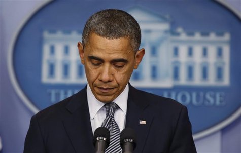 U.S. President Barack Obama pauses as he speaks about the shooting at Sandy Hook Elementary School in Newtown, Connecticut, during a press b U.S. President Barack Obama pauses as he speaks about the shooting at Sandy Hook Elementary School in Newtown, Connecticut, during a press b