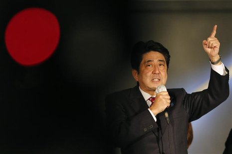 Japan's main opposition Liberal Democratic Party's (LDP) leader and former Prime Minister Shinzo Abe speaks to voters atop a campaign van at Japan's main opposition Liberal Democratic Party's (LDP) leader and former Prime Minister Shinzo Abe speaks to voters atop a campaign van at