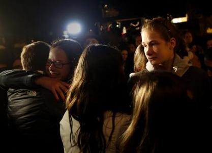 People grieve outside the overflow area of a vigil at the Saint Rose of Lima church in Newtown, Connecticut December 14, 2012. REUTERS-Shannon Stapleton
People grieve outside the overflow area of a vigil at the Saint Rose of Lima church in Newtown, Connecticut December 14, 2012. REUTERS-Shannon Stapleton