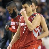 Houston Rockets guard Jeremy Lin and James Harden (L) walk of the court after losing their NBA basketball game against the Toronto Raptors i