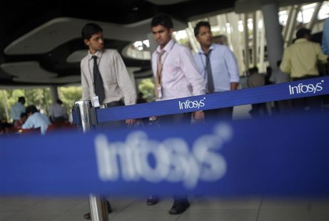 Employees of Indian software company Infosys walk past Infosys logos at their campus in the Electronic City area in Bangalore September 4, 2 Employees of Indian software company Infosys walk past Infosys logos at their campus in the Electronic City area in Bangalore September 4, 2