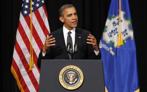 U.S. President Barack Obama gestures as he speaks at a vigil held at Newtown High School for families of victims of the Sandy Hook Elementar U.S. President Barack Obama gestures as he speaks at a vigil held at Newtown High School for families of victims of the Sandy Hook Elementar