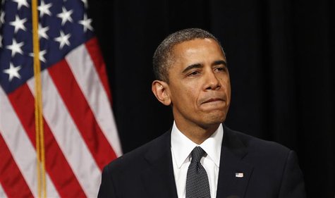 U.S. President Barack Obama looks down as he walks from the rostrum after speaking at a vigil held at Newtown High School for families of vi U.S. President Barack Obama looks down as he walks from the rostrum after speaking at a vigil held at Newtown High School for families of vi