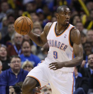 Oklahoma City Thunder forward Serge Ibaka of Congo plays against the San Antonio Spurs during the first half of their NBA basketball game in Oklahoma City Thunder forward Serge Ibaka of Congo plays against the San Antonio Spurs during the first half of their NBA basketball game in