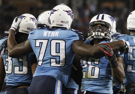 Tennessee Titans' safety Michael Griffin (33) celebrates after intercepting a pass in the end zone intended for New York Jets' tight end Jef Tennessee Titans' safety Michael Griffin (33) celebrates after intercepting a pass in the end zone intended for New York Jets' tight end Jef