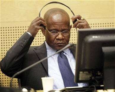 Congolese warlord Mathieu Ngudjolo Chui puts on his headset in the courtroom of the International Criminal Court in The Hague November 24, 2 Congolese warlord Mathieu Ngudjolo Chui puts on his headset in the courtroom of the International Criminal Court in The Hague November 24, 2