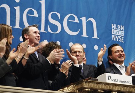 Nielsen CEO, David Calhoun, (2nd R) and company officials ring the opening bell at the New York Stock Exchange in celebration of their IPO, Nielsen CEO, David Calhoun, (2nd R) and company officials ring the opening bell at the New York Stock Exchange in celebration of their IPO,