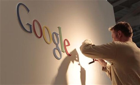 A man works on Google logo at an exhibition stand at the CeBIT computer fair in Hanover February 28, 2011. REUTERS/Tobias Schwarz A man works on Google logo at an exhibition stand at the CeBIT computer fair in Hanover February 28, 2011. REUTERS/Tobias Schwarz
