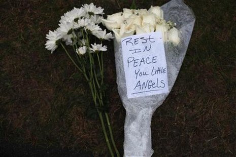 Flowers for the victims of the Sandy Hook Elementary School rest at a memorial in Newtown, Connecticut December 17, 2012. REUTERS/Joshua Lot Flowers for the victims of the Sandy Hook Elementary School rest at a memorial in Newtown, Connecticut December 17, 2012. REUTERS/Joshua Lot