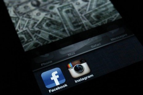 A photo illustration shows the applications Facebook and Instagram on the screen of an iPhone in Zagreb April 9, 2012. REUTERS/Antonio Broni A photo illustration shows the applications Facebook and Instagram on the screen of an iPhone in Zagreb April 9, 2012. REUTERS/Antonio Broni