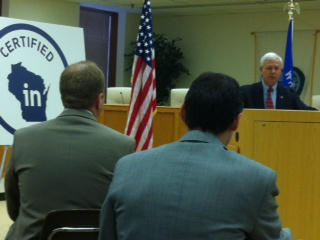 Wisconsin Economic Development Corporation CEO/Secretary Reed Hall speaking in West Bend regarding Corporate Center site certification on December 10, 2012. (courtesy of Twitter) Wisconsin Economic Development Corporation CEO/Secretary Reed Hall speaking in West Bend regarding Corporate Center site certification on December 10, 2012. (courtesy of Twitter)