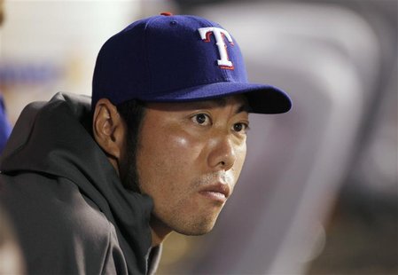 Texas Rangers relief pitcher Koji Uehara of Japan, who is currently on the disabled list, sits in the dugout against the Los Angeles Angels Texas Rangers relief pitcher Koji Uehara of Japan, who is currently on the disabled list, sits in the dugout against the Los Angeles Angels