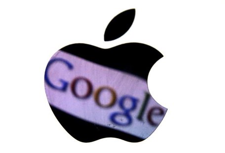 A Google trademark is reflected in Apple logo in this photo illustration taken in Berlin, August 31, 2012. REUTERS/Pawel Kopczynski A Google trademark is reflected in Apple logo in this photo illustration taken in Berlin, August 31, 2012. REUTERS/Pawel Kopczynski
