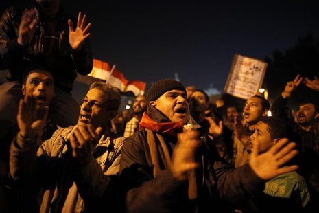 Protesters opposing Egypt's President Mohamed Mursi shout slogans as they demonstrate in front of the presidential palace in Cairo December Protesters opposing Egypt's President Mohamed Mursi shout slogans as they demonstrate in front of the presidential palace in Cairo December