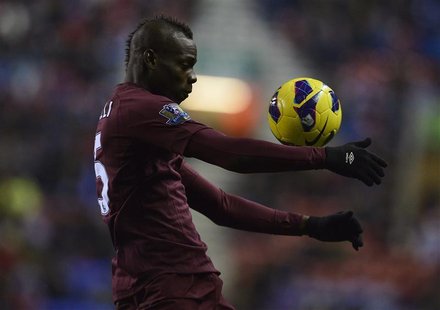Manchester City's Mario Balotelli controls the ball during their English Premier League soccer match against Wigan Athletic in Wigan, northe Manchester City's Mario Balotelli controls the ball during their English Premier League soccer match against Wigan Athletic in Wigan, northe