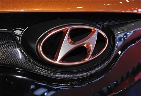 Detail view of the Hyundai logo on their Veloster model shown during the final press preview day for the North American International Auto S Detail view of the Hyundai logo on their Veloster model shown during the final press preview day for the North American International Auto S