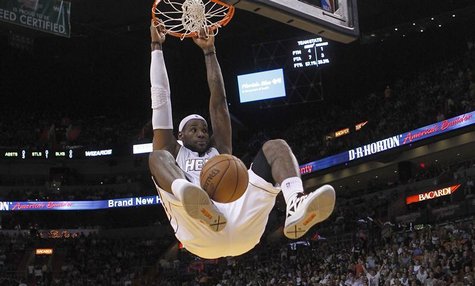 Miami Heat's LeBron James dunks against the Washington Wizards in the first half of their NBA basketball game in Miami, Florida December 15, Miami Heat's LeBron James dunks against the Washington Wizards in the first half of their NBA basketball game in Miami, Florida December 15,