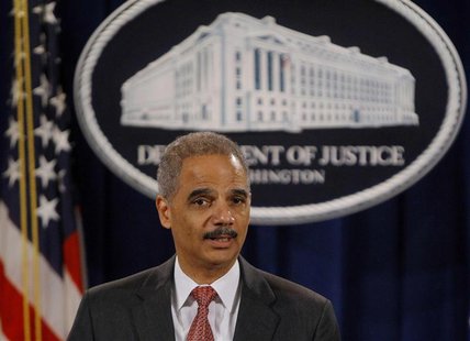 U.S. Attorney General Eric Holder announces enforcement actions against UBS Securities Japan Co. Ltd.investment bank at the Justice Departme U.S. Attorney General Eric Holder announces enforcement actions against UBS Securities Japan Co. Ltd.investment bank at the Justice Departme