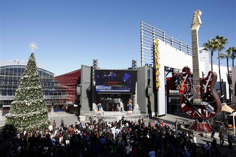 People watch a live broadcast of the memorial service for Mexican-American singer and Spanish language television personality Jenni Rivera a People watch a live broadcast of the memorial service for Mexican-American singer and Spanish language television personality Jenni Rivera a