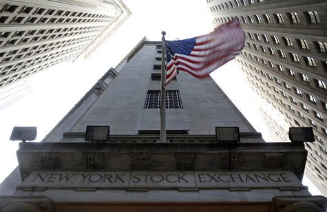 The U.S. flag waves in the breeze above one of the entrances to the New York Stock Exchange, November 19, 2012. REUTERS/Chip East The U.S. flag waves in the breeze above one of the entrances to the New York Stock Exchange, November 19, 2012. REUTERS/Chip East
