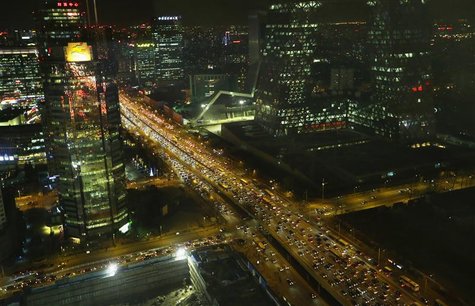 Vehicles drive on the 3rd Ring Road through Beijing's central business district, December 17, 2012. REUTERS/Jason Lee Vehicles drive on the 3rd Ring Road through Beijing's central business district, December 17, 2012. REUTERS/Jason Lee