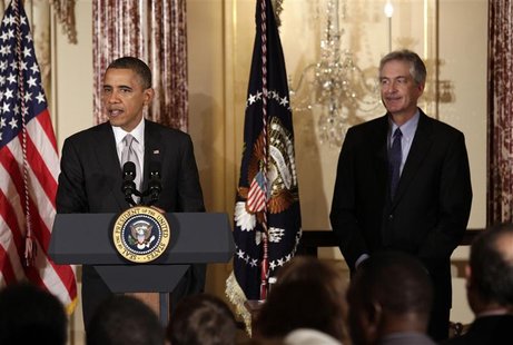 U.S. President Barack Obama delivers remarks next to Deputy Secretary of State William Burns at the Diplomatic Corps holiday reception at th U.S. President Barack Obama delivers remarks next to Deputy Secretary of State William Burns at the Diplomatic Corps holiday reception at th
