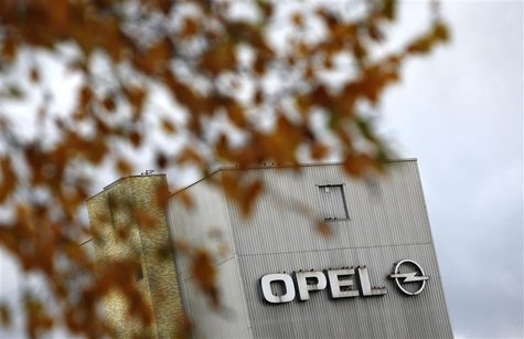 Leaves of a tree are pictured in front of a factory building with a logo of German car manufacturer Opel at the headquarters in Ruesselsheim Leaves of a tree are pictured in front of a factory building with a logo of German car manufacturer Opel at the headquarters in Ruesselsheim