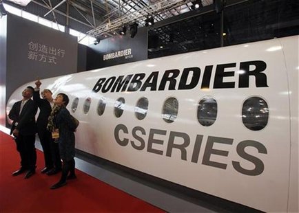 Visitors chat in front of a mock cabin of a Bombardier business jet on the first day of the China International Aviation & Aerospace Exhibit Visitors chat in front of a mock cabin of a Bombardier business jet on the first day of the China International Aviation & Aerospace Exhibit