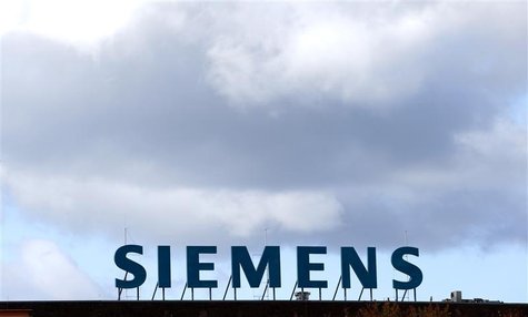 The logo of Siemens AG company is pictured atop a factory in Berlin October 9, 2012. REUTERS/Fabrizio Bensch The logo of Siemens AG company is pictured atop a factory in Berlin October 9, 2012. REUTERS/Fabrizio Bensch