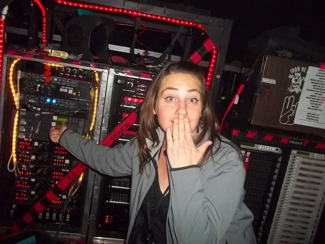 Charli McKenzie attempts to turn up the cowbell backstage at the Resch Center
