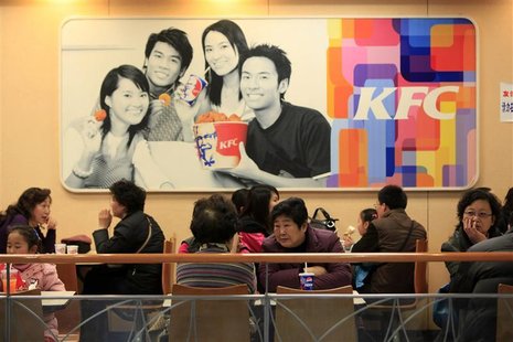 People dine at a Kentucky Fried Chicken (KFC) outlet in Shanghai February 3, 2010. REUTERS/Aly Song People dine at a Kentucky Fried Chicken (KFC) outlet in Shanghai February 3, 2010. REUTERS/Aly Song