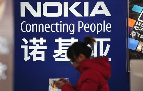 A woman walks past a Nokia advertisement board at a home appliances store in Shenyang, Liaoning province December 6, 2012. REUTERS/Stringer A woman walks past a Nokia advertisement board at a home appliances store in Shenyang, Liaoning province December 6, 2012. REUTERS/Stringer