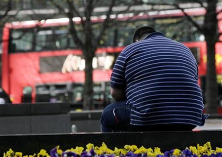 A man sits on a wall in the Canary Wharf financial district of London, April 1, 2009. REUTERS/Simon Newman A man sits on a wall in the Canary Wharf financial district of London, April 1, 2009. REUTERS/Simon Newman