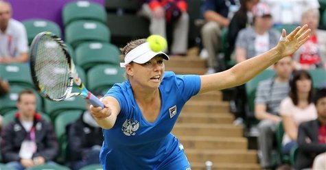 Russia's Vera Zvonareva reaches for a return to Serena Williams of the U.S. in their women's singles tennis match at the All England Lawn Te Russia's Vera Zvonareva reaches for a return to Serena Williams of the U.S. in their women's singles tennis match at the All England Lawn Te
