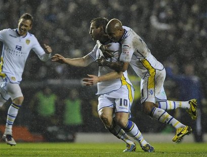 Leeds United's Luciano Becchio (C) celebrates his goal with El-Hadji Diouf (R) during their English League Cup quarter-final soccer match ag Leeds United's Luciano Becchio (C) celebrates his goal with El-Hadji Diouf (R) during their English League Cup quarter-final soccer match ag