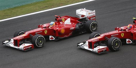 Ferrari Formula One driver Fernando Alonso of Spain (L) drives ahead of team mate Felipe Massa of Brazil during the Brazilian F1 Grand Prix Ferrari Formula One driver Fernando Alonso of Spain (L) drives ahead of team mate Felipe Massa of Brazil during the Brazilian F1 Grand Prix