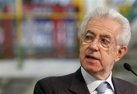 Italy's Prime Minister Mario Monti (C) looks as he makes his speech during a visit to the Fiat car factory in the southern city of Melfi Dec Italy's Prime Minister Mario Monti (C) looks as he makes his speech during a visit to the Fiat car factory in the southern city of Melfi Dec