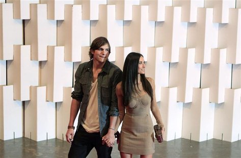 Actor Ashton Kutcher and his wife actress Demi Moore (R) arrive for Colcci's Winter 2011 collection during Sao Paulo Fashion Week January 30 Actor Ashton Kutcher and his wife actress Demi Moore (R) arrive for Colcci's Winter 2011 collection during Sao Paulo Fashion Week January 30