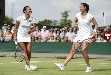 Heather Watson of Britain (L) and her partner Laura Robson of Britain laugh during their women's doubles tennis match against Hsieh Su-Wei o Heather Watson of Britain (L) and her partner Laura Robson of Britain laugh during their women's doubles tennis match against Hsieh Su-Wei o