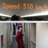 An attendant stands inside a high-speed train during an organized experience trip from Beijing to Zhengzhou, as part of a new rail line, Dec An attendant stands inside a high-speed train during an organized experience trip from Beijing to Zhengzhou, as part of a new rail line, Dec