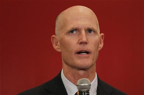 Republican Florida Governor Rick Scott speaks at a meeting of the Latin Builders Association in Miami, Florida January 27, 2012. REUTERS/Joe Republican Florida Governor Rick Scott speaks at a meeting of the Latin Builders Association in Miami, Florida January 27, 2012. REUTERS/Joe